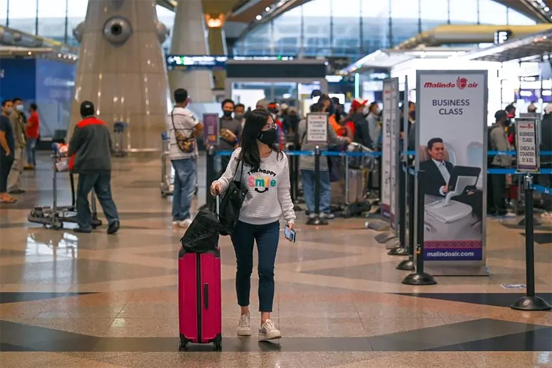 The decision to allow more people to use the autogate facilities will also ease congestion at KLIA’s immigration counters. PHOTO: AFP